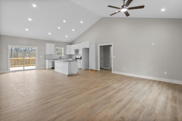 Vaulted great room open to the kitchen at the Lakeside Getaway home in Mt. Gilead, NC